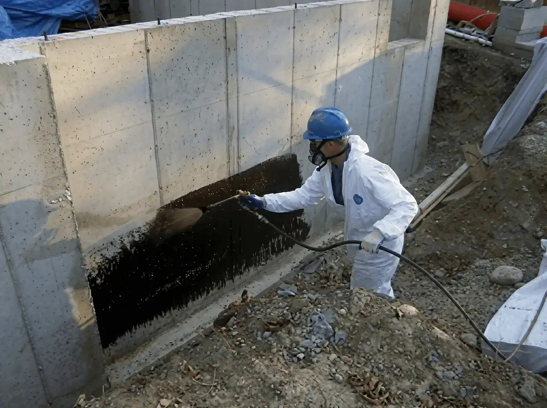 Professional waterproofing the exterior walls of the basement in Phoenix, AZ