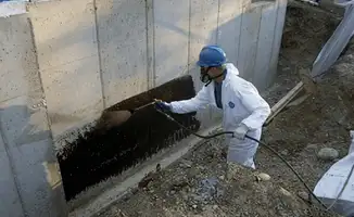 Professional waterproofing the exterior walls of the basement in Phoenix, AZ
