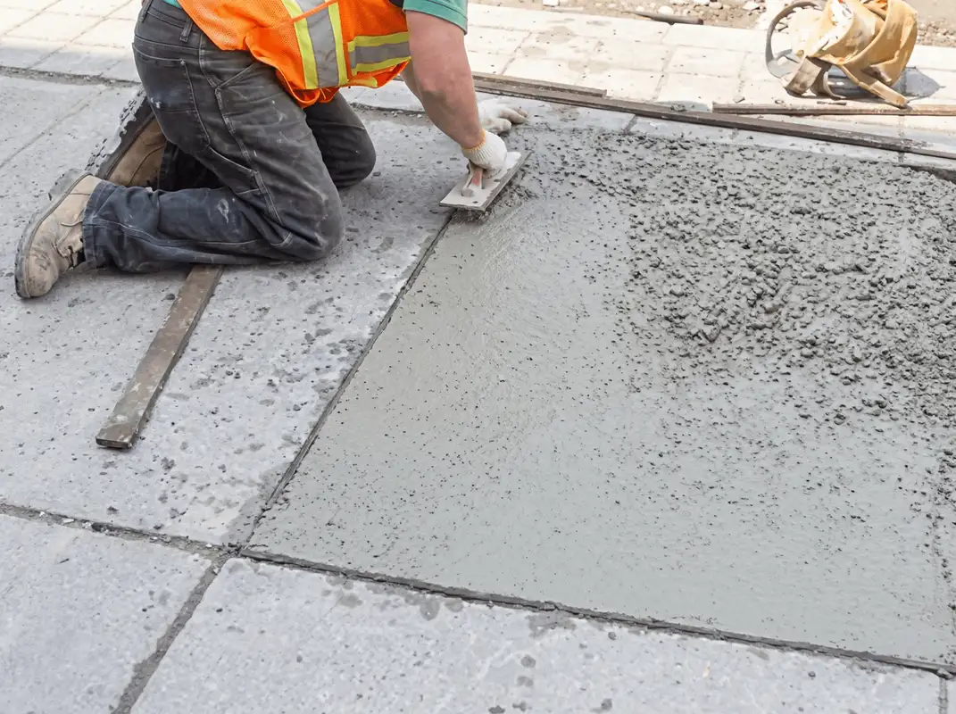 Professional repairing a concrete floor in Phoenix, AZ