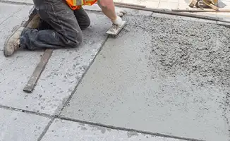 Professional repairing a concrete floor in Phoenix, AZ